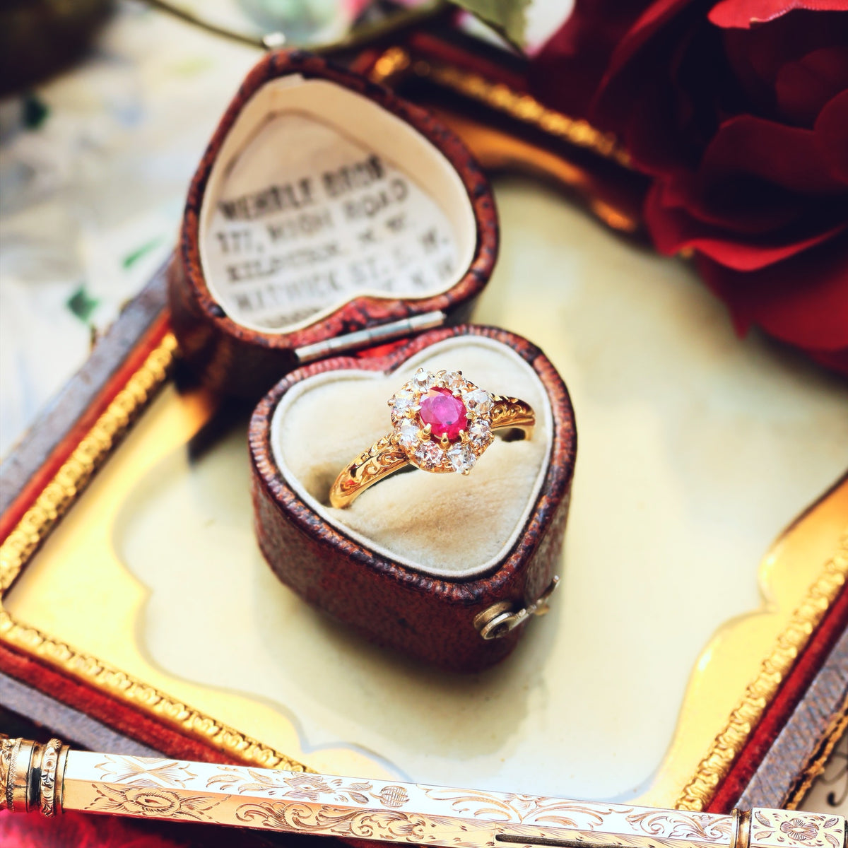 An Antique Ruby & Diamond Blossom Engagement Ring
