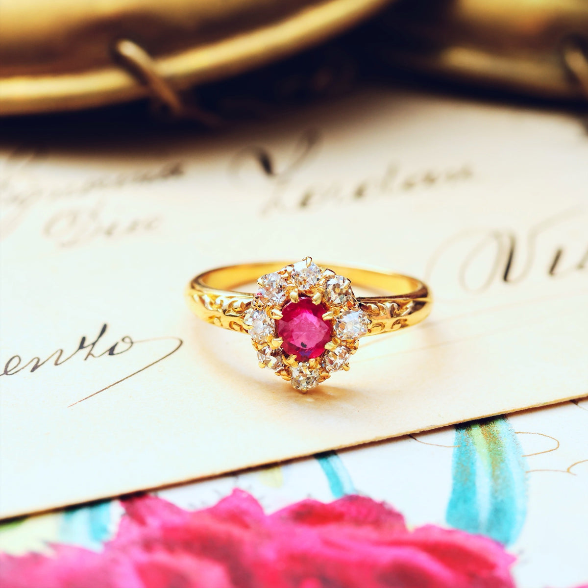 An Antique Ruby & Diamond Blossom Engagement Ring