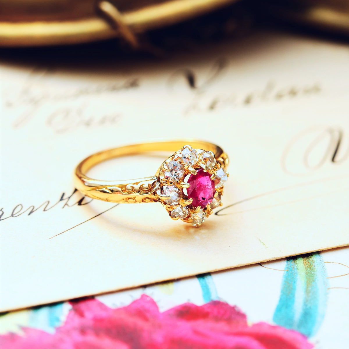 An Antique Ruby & Diamond Blossom Engagement Ring