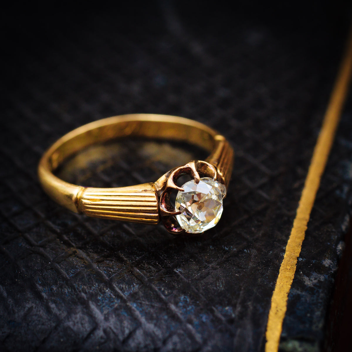 Captivating Antique Cushion-cut Diamond Solitaire Engagement Ring