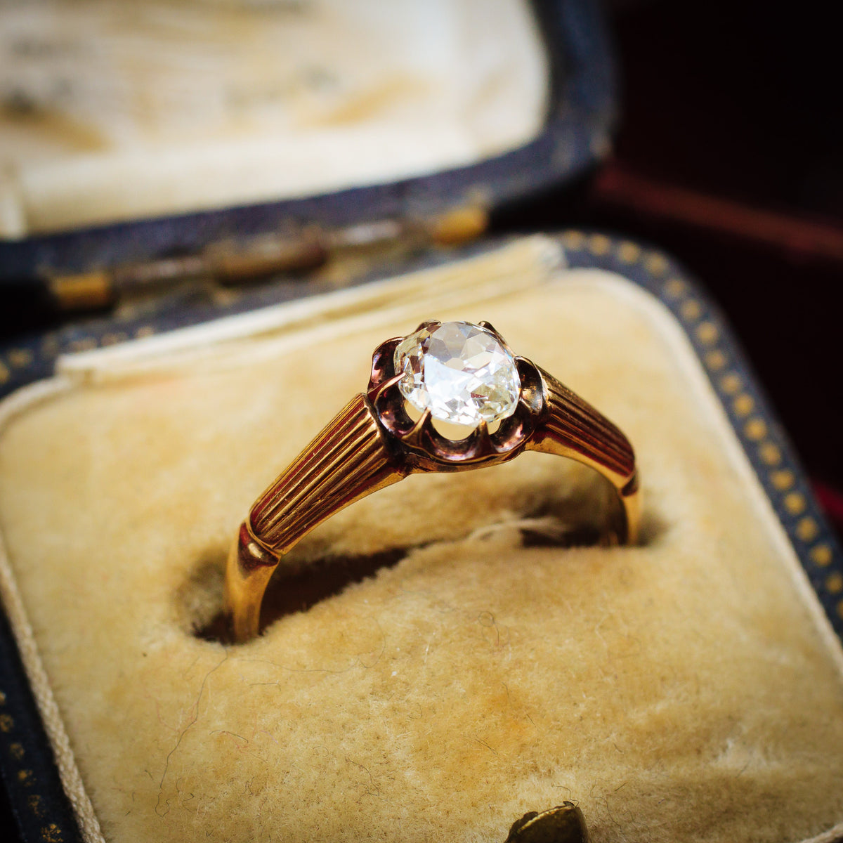 Captivating Antique Cushion-cut Diamond Solitaire Engagement Ring
