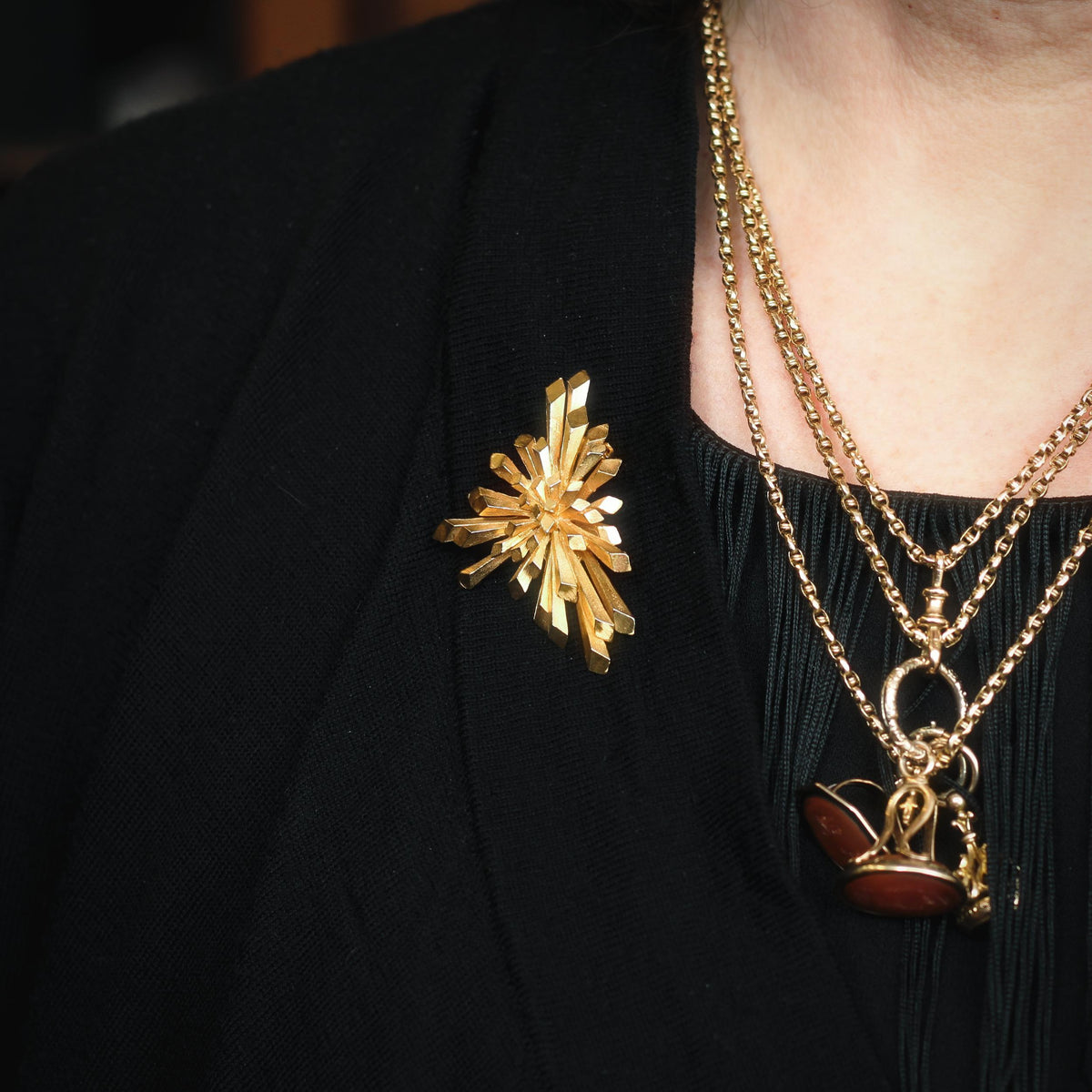 Weaponize your clothing with brooches...