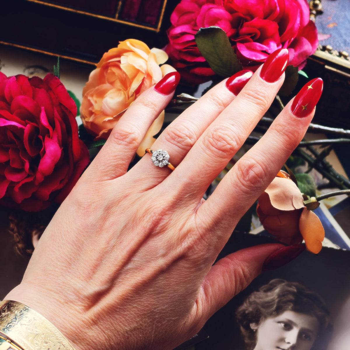 An Antique Hand Cut Diamond Cluster Engagement Ring