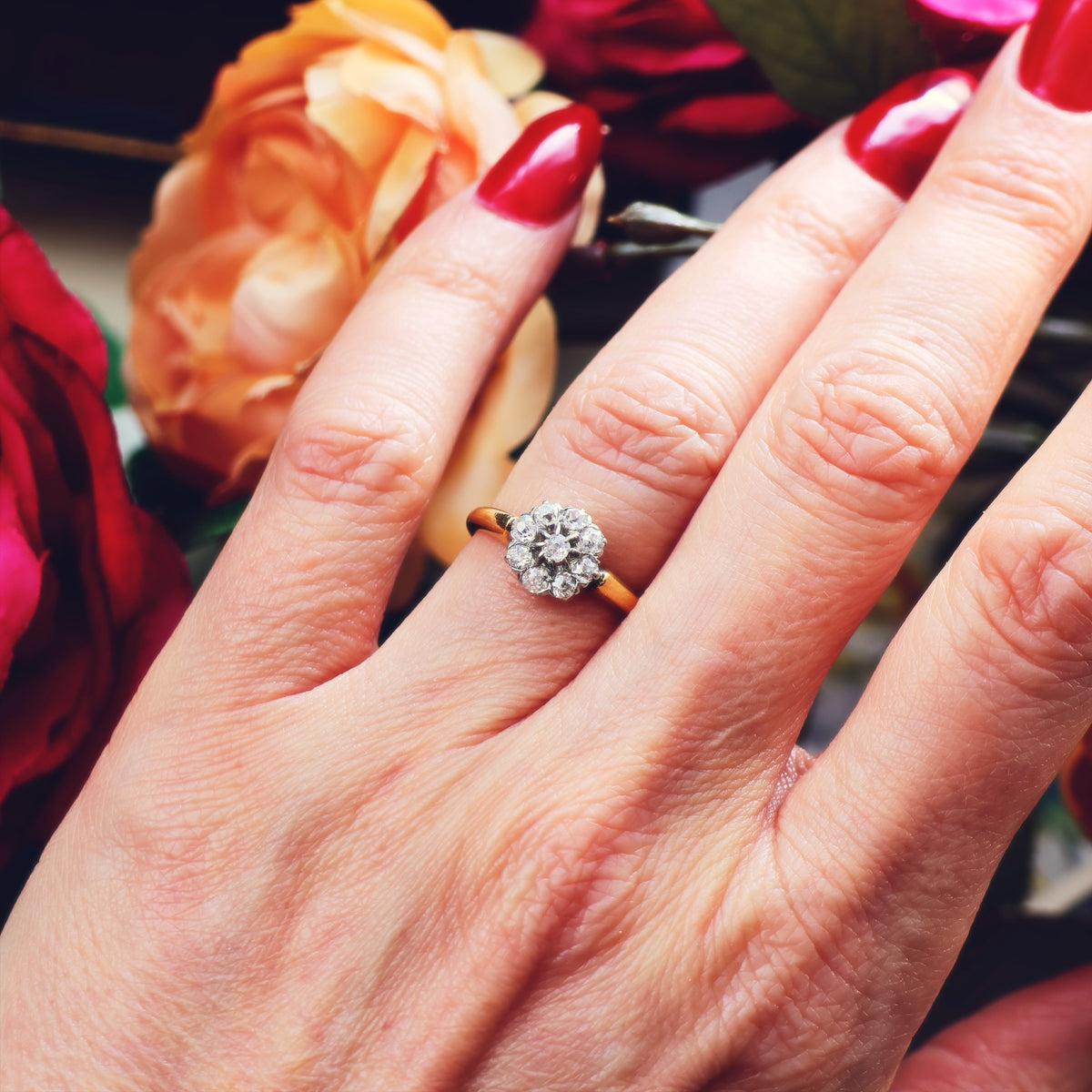 An Antique Hand Cut Diamond Cluster Engagement Ring