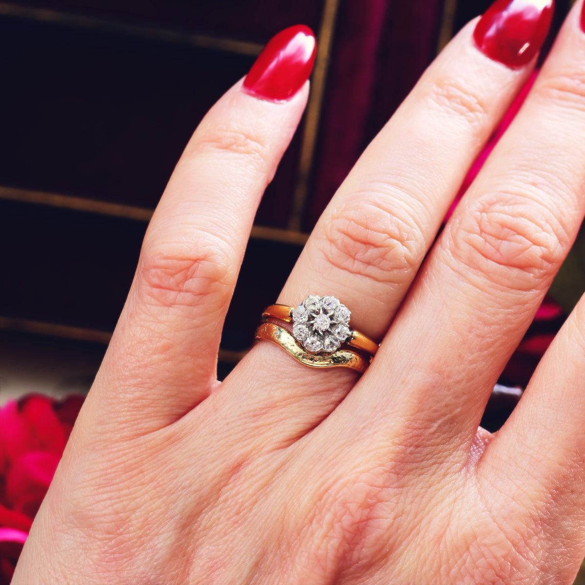 An Antique Hand Cut Diamond Cluster Engagement Ring