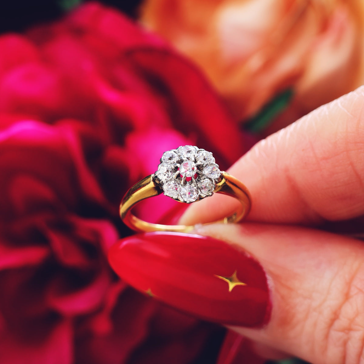 An Antique Hand Cut Diamond Cluster Engagement Ring