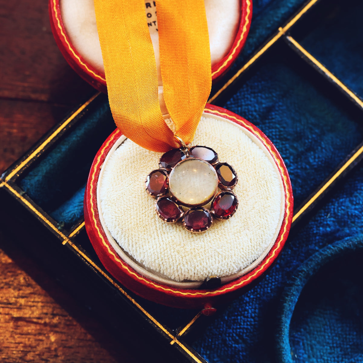 Circa 1820 Georgian Flat Top Garnet Lace Locket