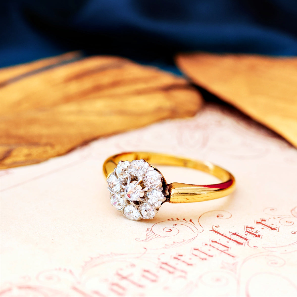 An Antique Hand Cut Diamond Cluster Engagement Ring