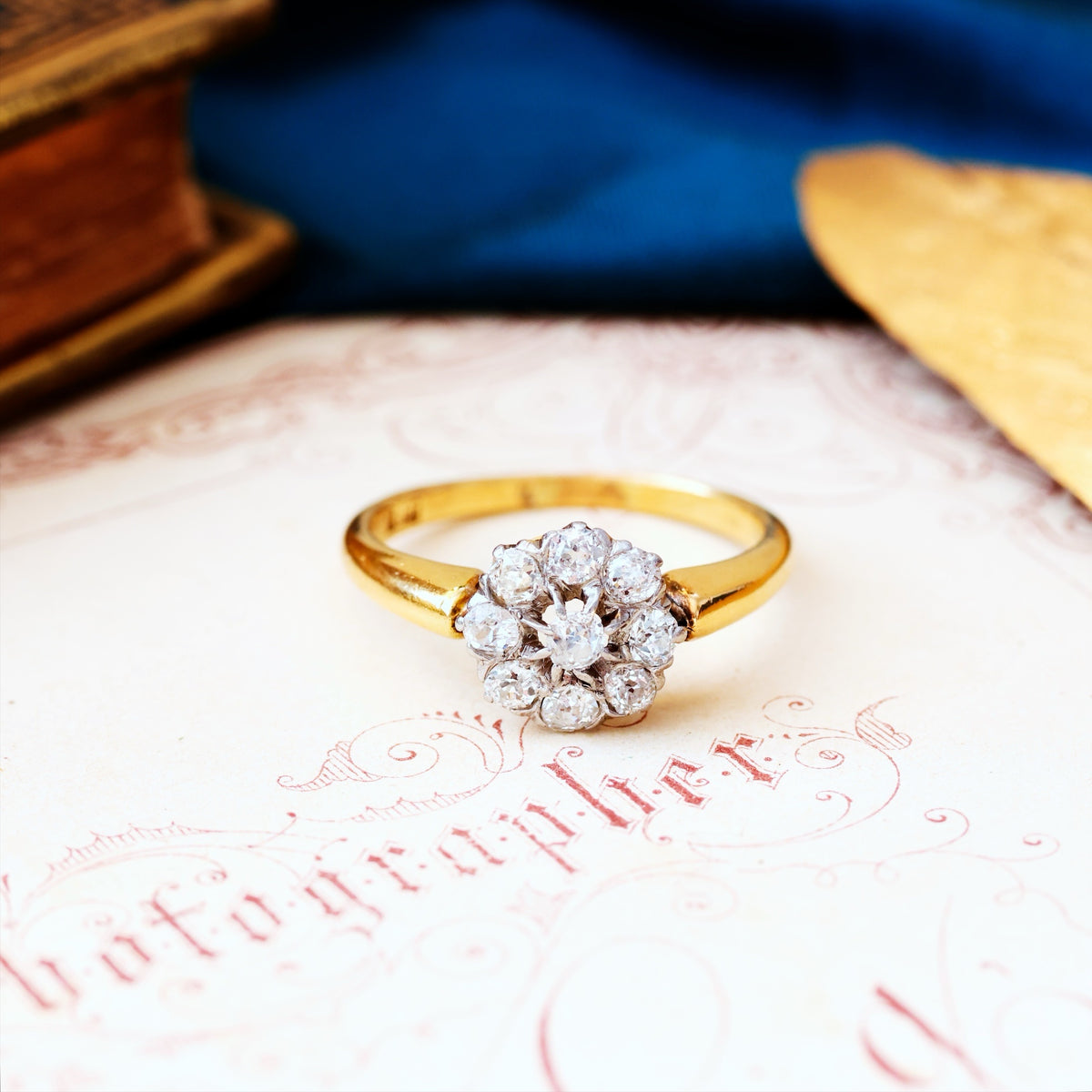 An Antique Hand Cut Diamond Cluster Engagement Ring