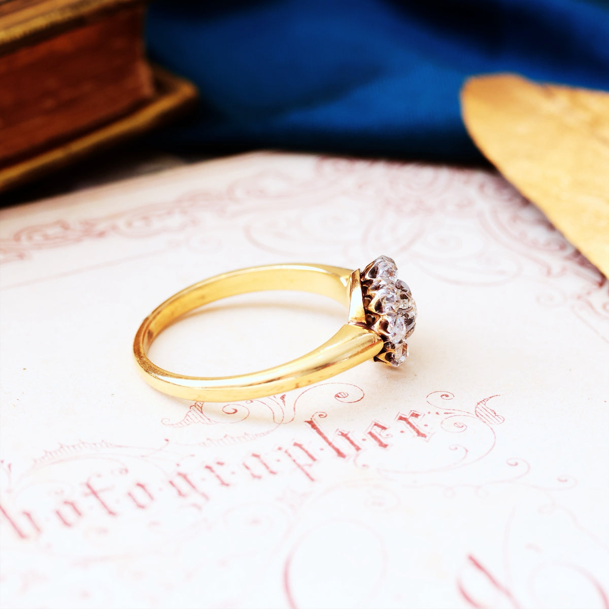 An Antique Hand Cut Diamond Cluster Engagement Ring
