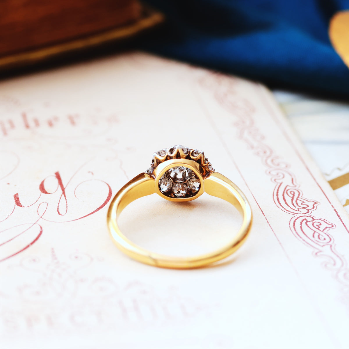 An Antique Hand Cut Diamond Cluster Engagement Ring