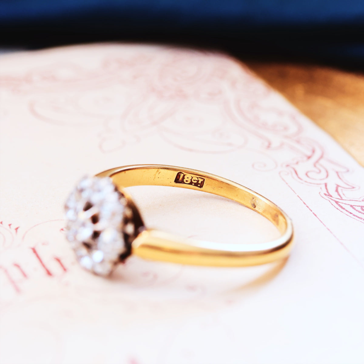 An Antique Hand Cut Diamond Cluster Engagement Ring