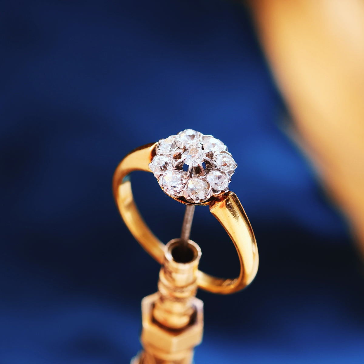 An Antique Hand Cut Diamond Cluster Engagement Ring
