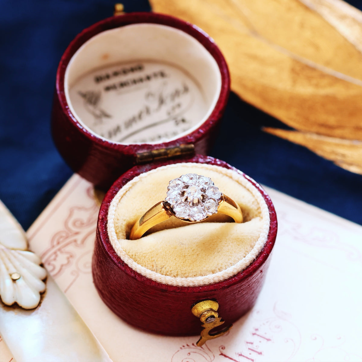 An Antique Hand Cut Diamond Cluster Engagement Ring