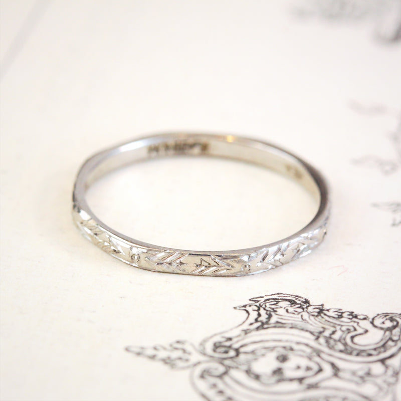 Platinum engraved shop wedding band