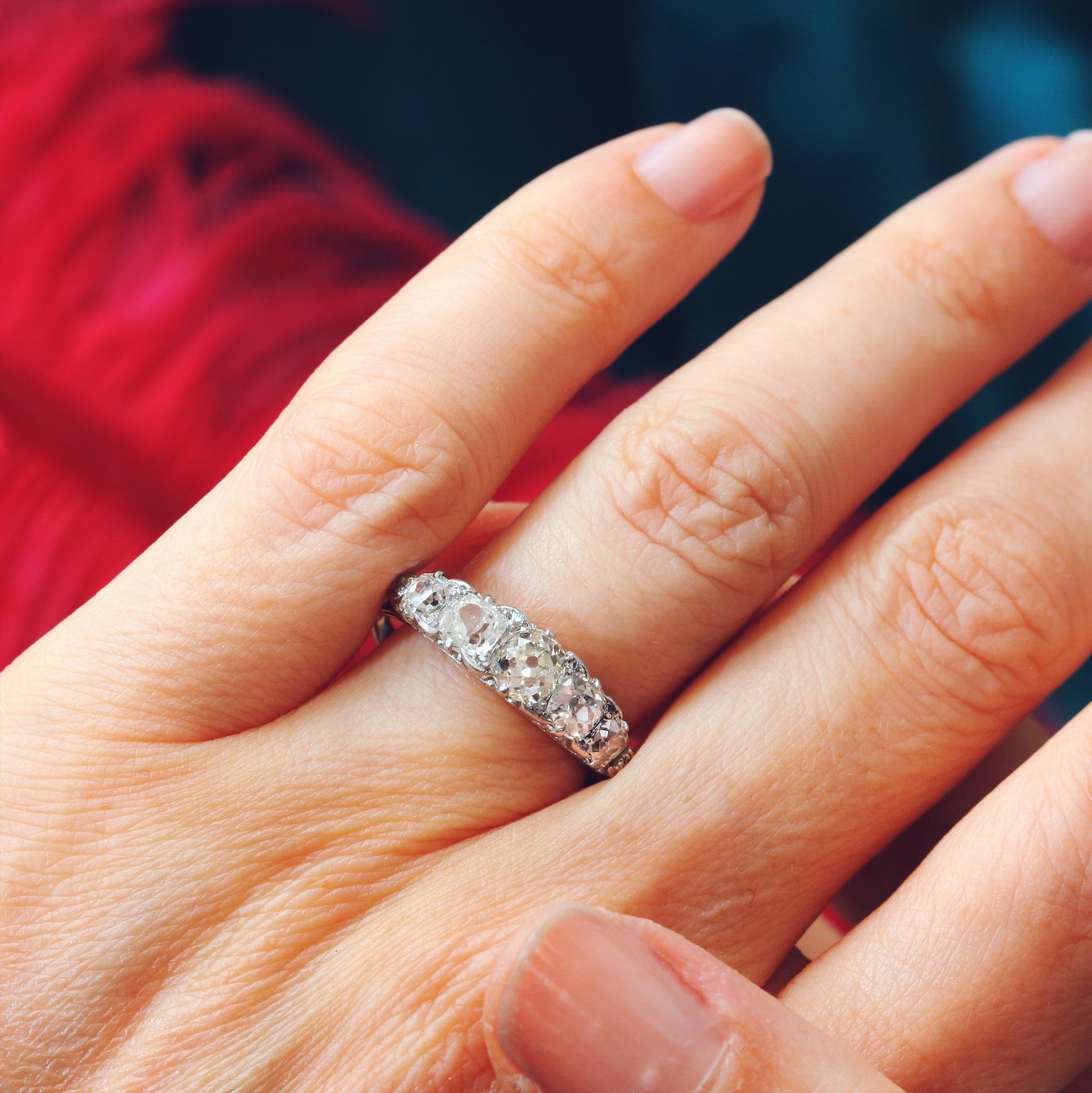 5 stone diamond shop ring on hand